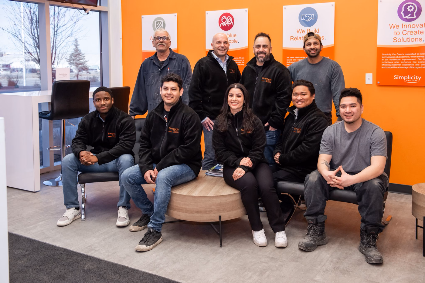 The Ultimate Car Care Group team in the customer lounge at the Country Hills shop.